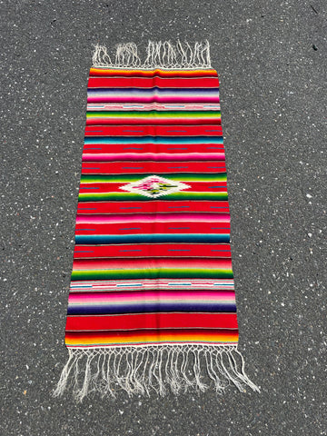 Colorful handwoven Mexican tapestry with bold traditional patterns and fringe, 46 x 117 cm
