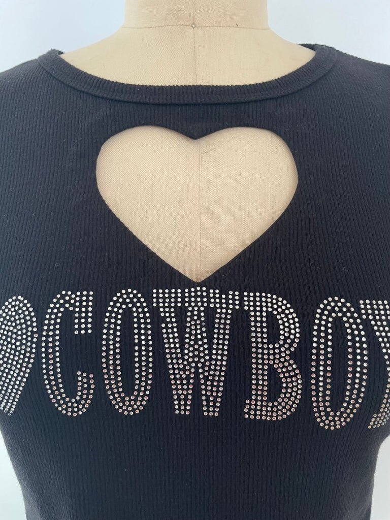 A black  heart cut-out and 'I LOVE COWBOYS' print in rhinestones, displayed on a mannequin.