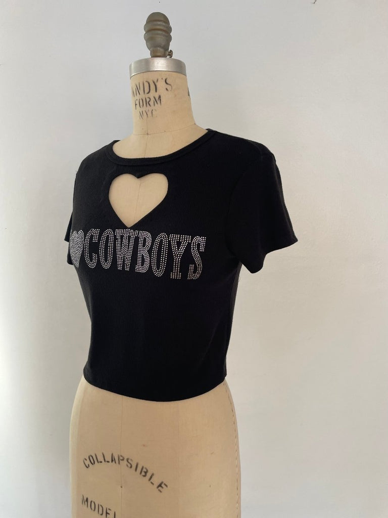black heart cut-out crop tee with 'I Love Cowboys' rhinestone graphic on front, displayed on XS mannequin