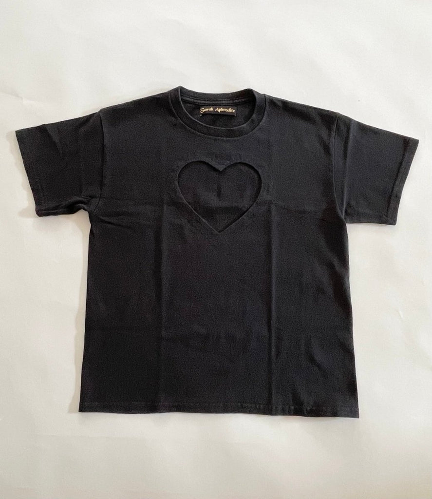 front  view of handmade heart cut-out t-shirt  displayed flat out on the floor