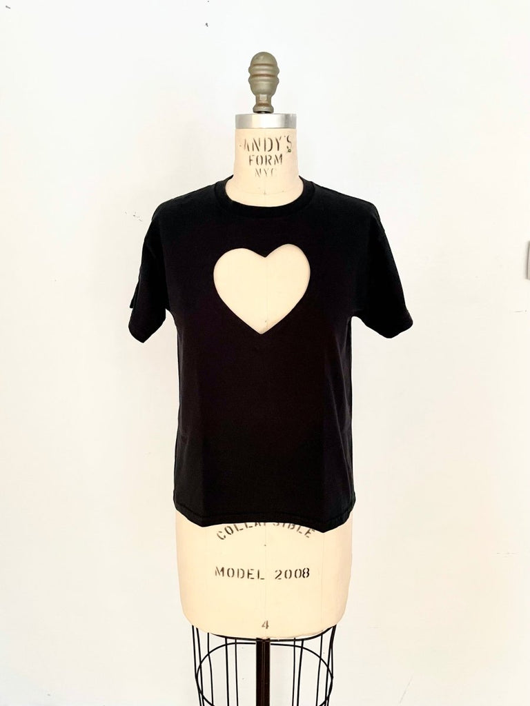 Front view of handmade heart cut-out t-shirt displayed on a mannequin