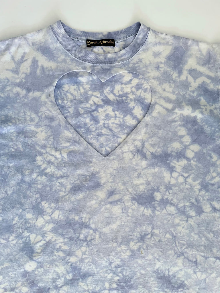 Tie-dye sweatshirt with a heart design on a plain background