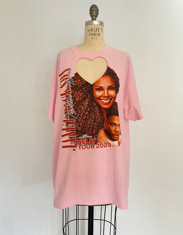 A pink t-shirt with a heart cut-out and a graphic print featuring Janet Jackson and Nelly. The t-shirt is displayed on a mannequin.