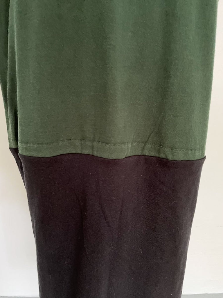 One-of-a-kind sustainable heart cut-out t-shirt dress by Sarah Aphrodite, handmade from repurposed t-shirts. Features yellow “NEW YORK” embroidery, natural fading marks, and fits Medium.