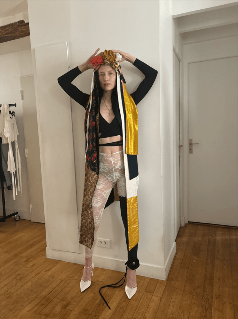 model wearing various long, avant garde multi colored headpieces made with upcycled fabric by Sarah Aphrodite