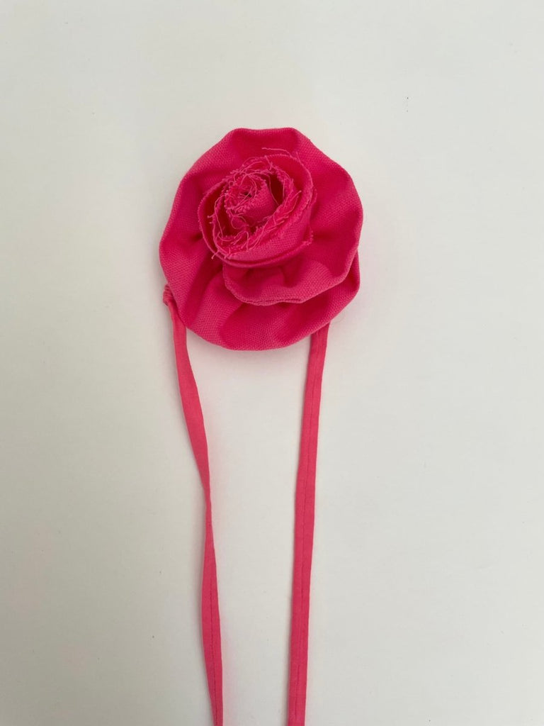 Handmade pink flower ankle accessory with elastic ties, crafted from upcycled fabric