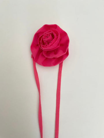 Handmade pink flower ankle accessory with elastic ties, crafted from upcycled fabric