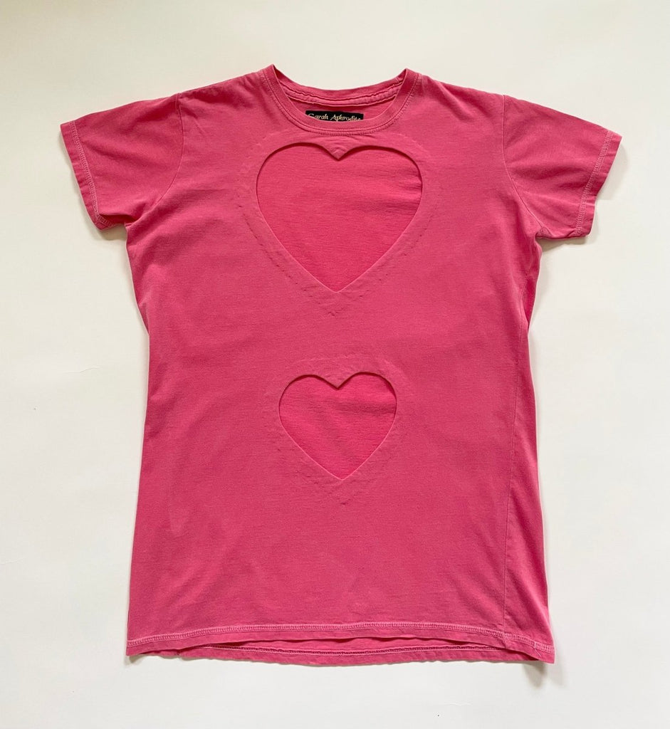 A pink fitted double heart cut-out T-shirt displayed flat on a white background