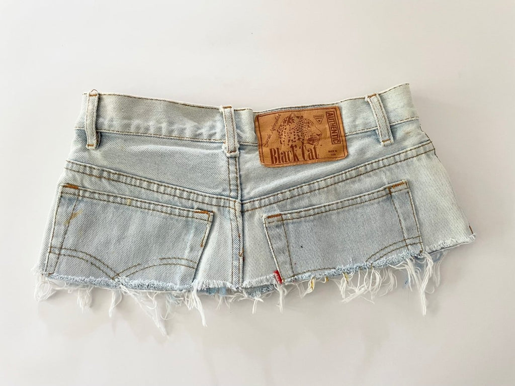 Recycled bleached denim belt with black silkscreen print, frayed edge, rustic hardware, and original label – size 28 waist