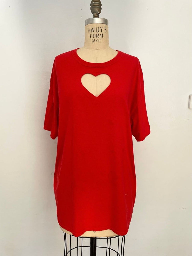 Handmade red cotton T-shirt with chest heart cut-out, featuring natural oil stain details, shown on mannequin.