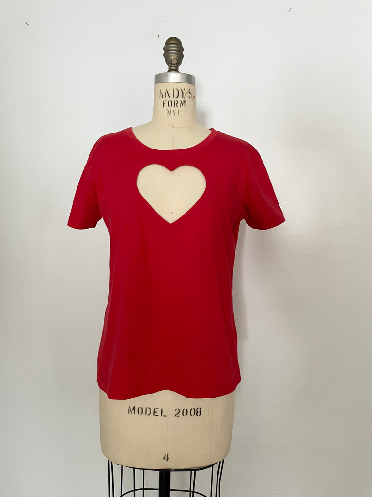 Front view of a one-of-a-kind red heart cut-out t-shirt with crew neck displayed on a mannequin