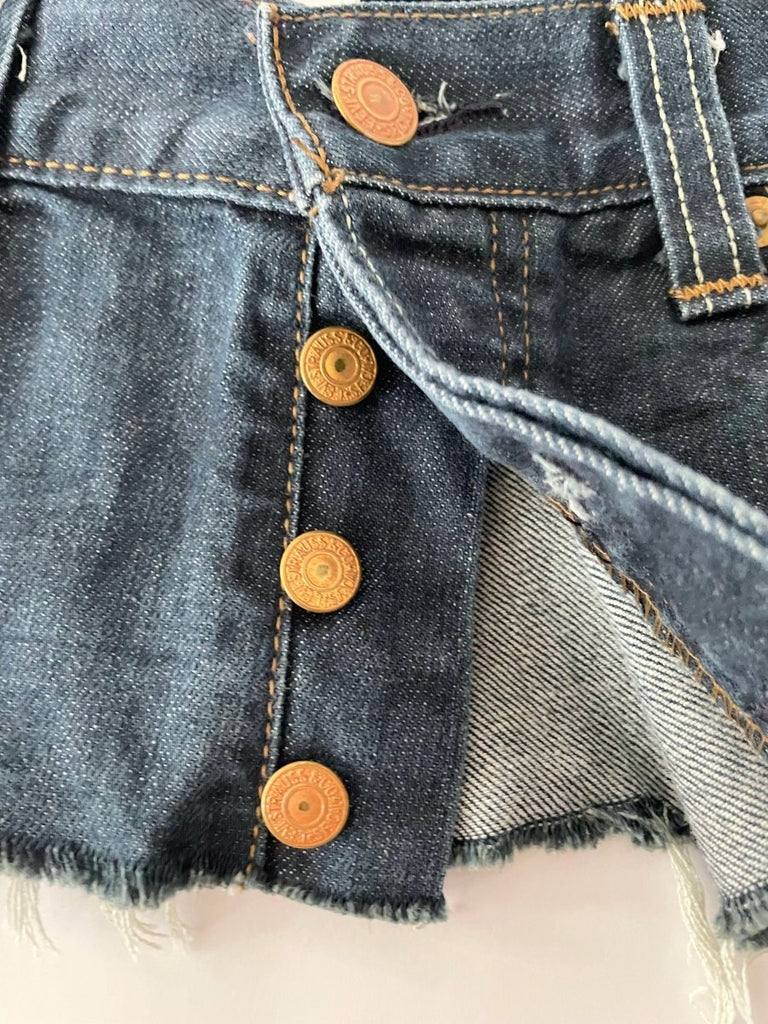 cloe up view of one-of-a-kind repurposed denim belt with button closure, size 29 waist