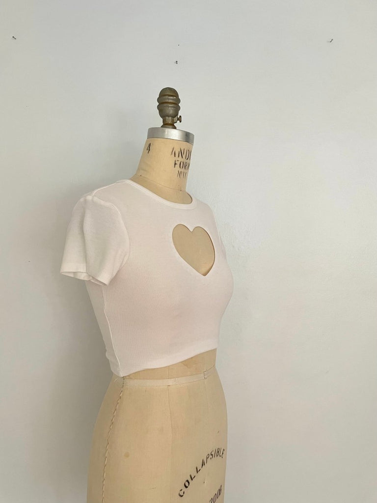 One-of-a-kind handmade stretchy cropped heart cut-out top by Sarah Aphrodite, shown on XS mannequin at an angle


