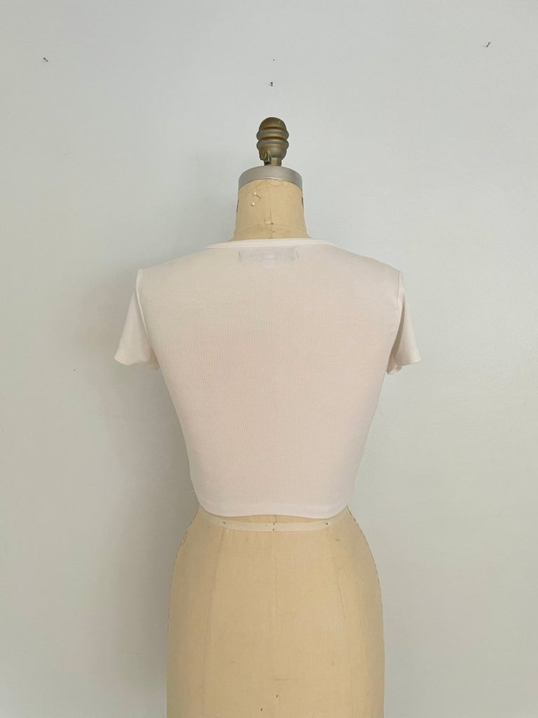 back view of One-of-a-kind handmade stretchy cropped heart cut-out top by Sarah Aphrodite, shown on XS mannequin

