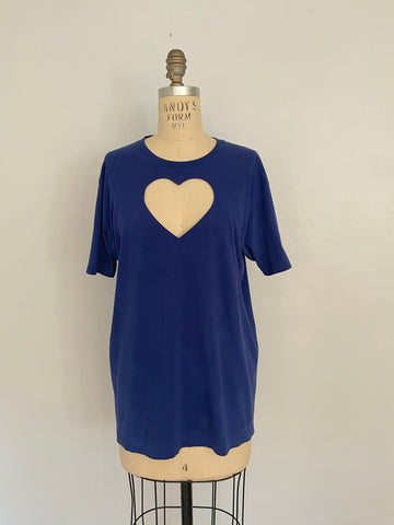 Ultramarine blue t-shirt with a heart cut-out design in the center, displayed on a mannequin.