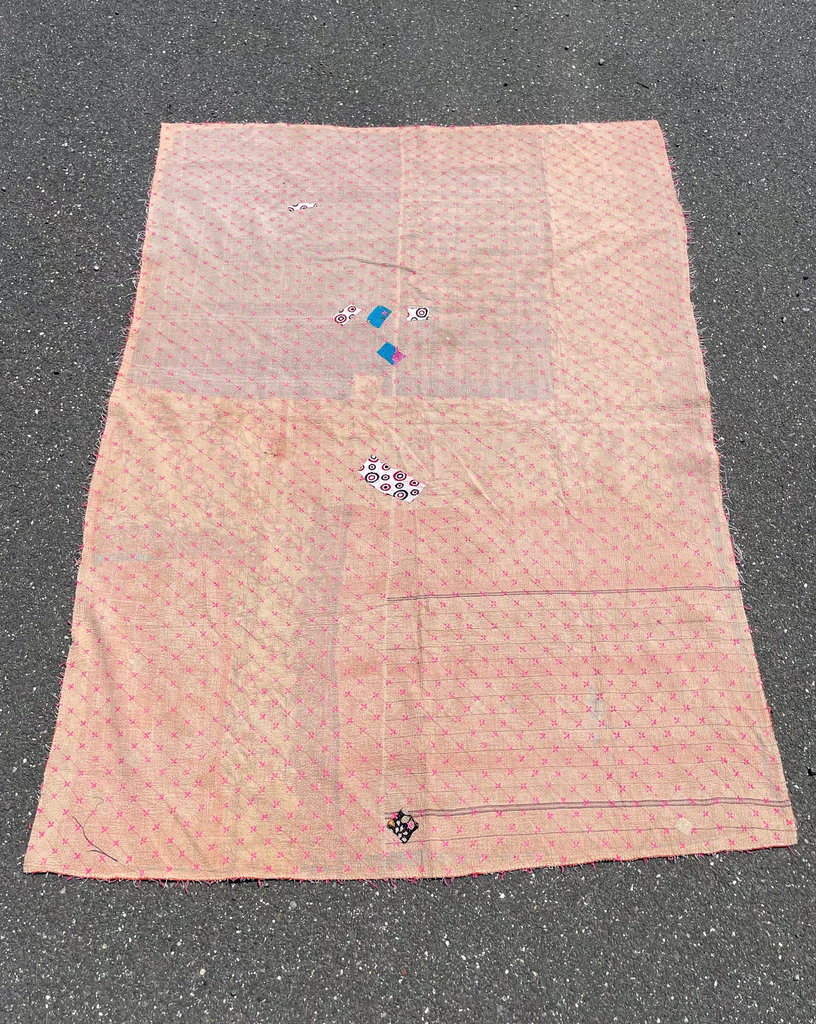 Vintage handmade Indian quilt made from recycled fabrics with raw edges and hand-stitched details, 66 x 93 inches
