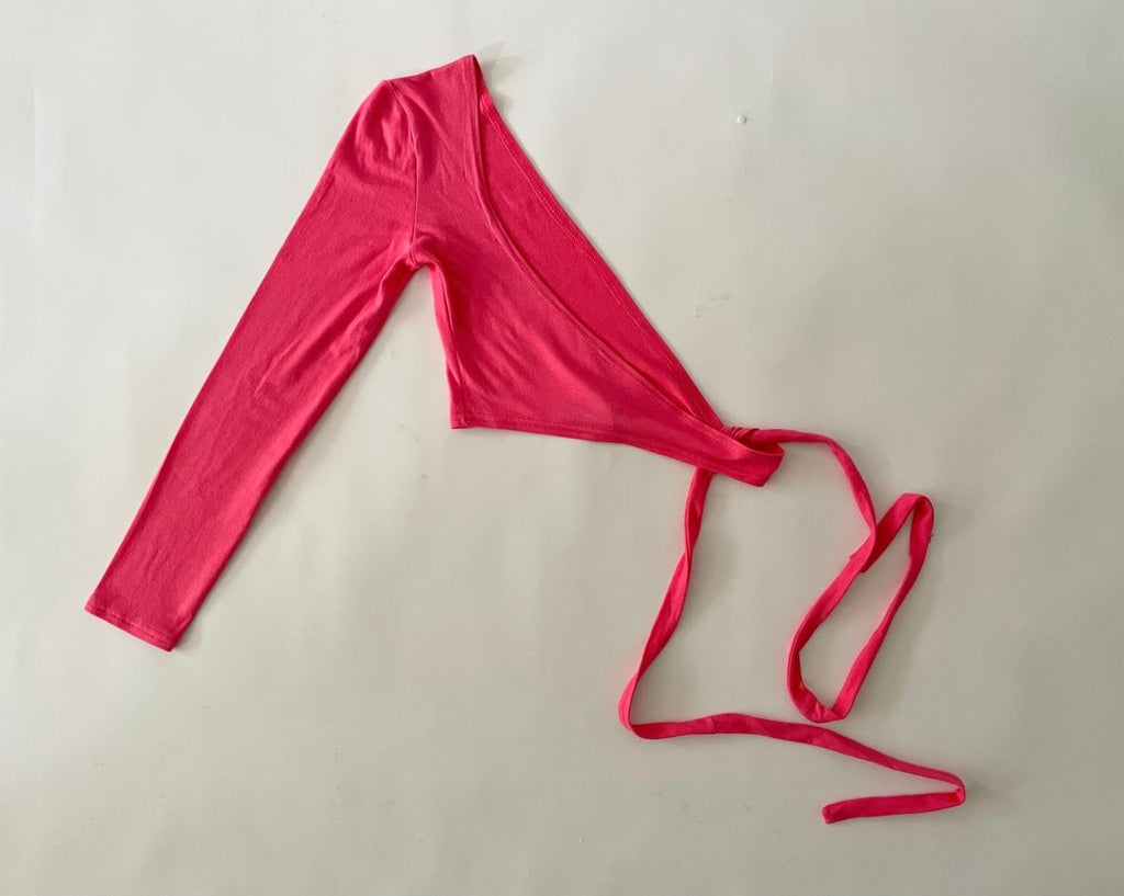pink top with a tie closure on a white background