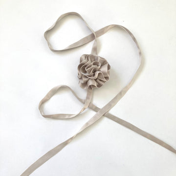 One-of-a-kind silk periwinkle flower accessory by Sarah Aphrodite, hand-sewn from upcycled fabric scraps. Versatile design with ties, worn as bracelet, anklet, neck, or arm accessory.