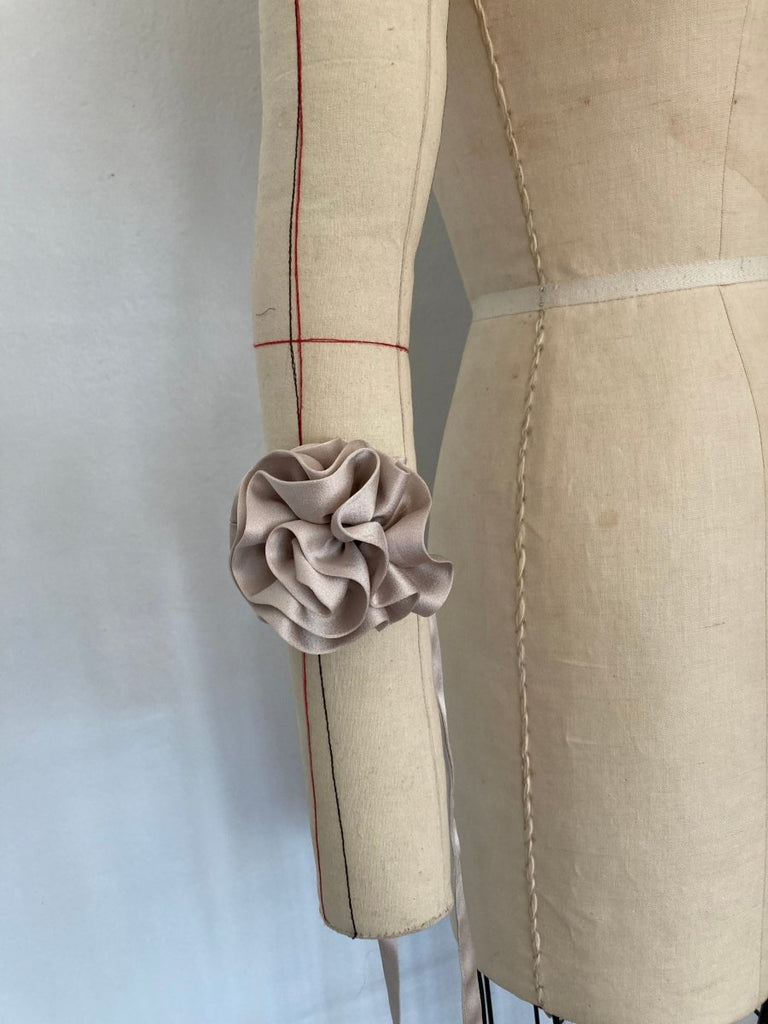 One-of-a-kind silk periwinkle flower accessory by Sarah Aphrodite, hand-sewn from upcycled fabric scraps. Versatile design with ties, worn as bracelet, anklet, neck, or arm accessory.