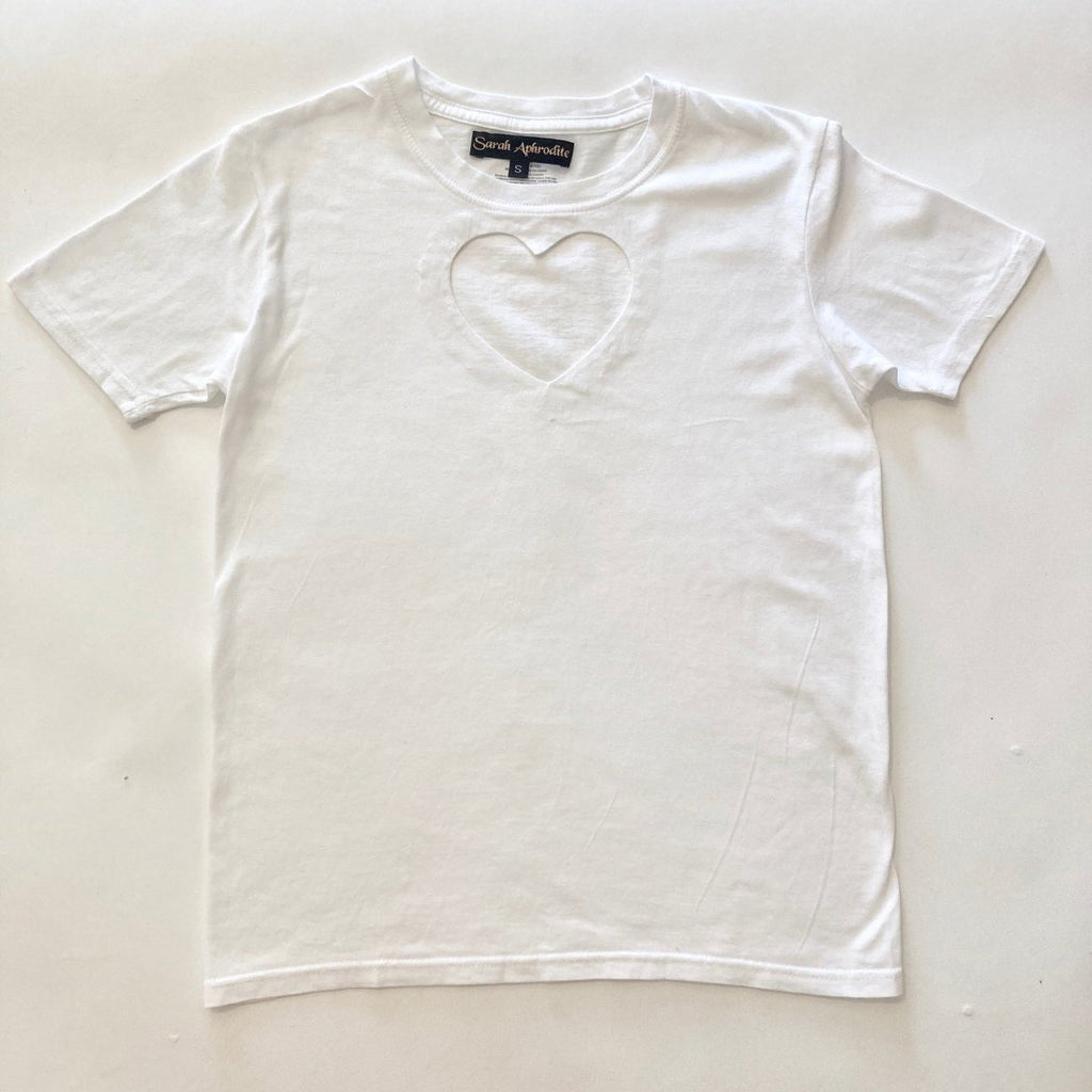 White handmade upcycled heart cut out T-shirt by Sarah Aphrodite flat on the ground