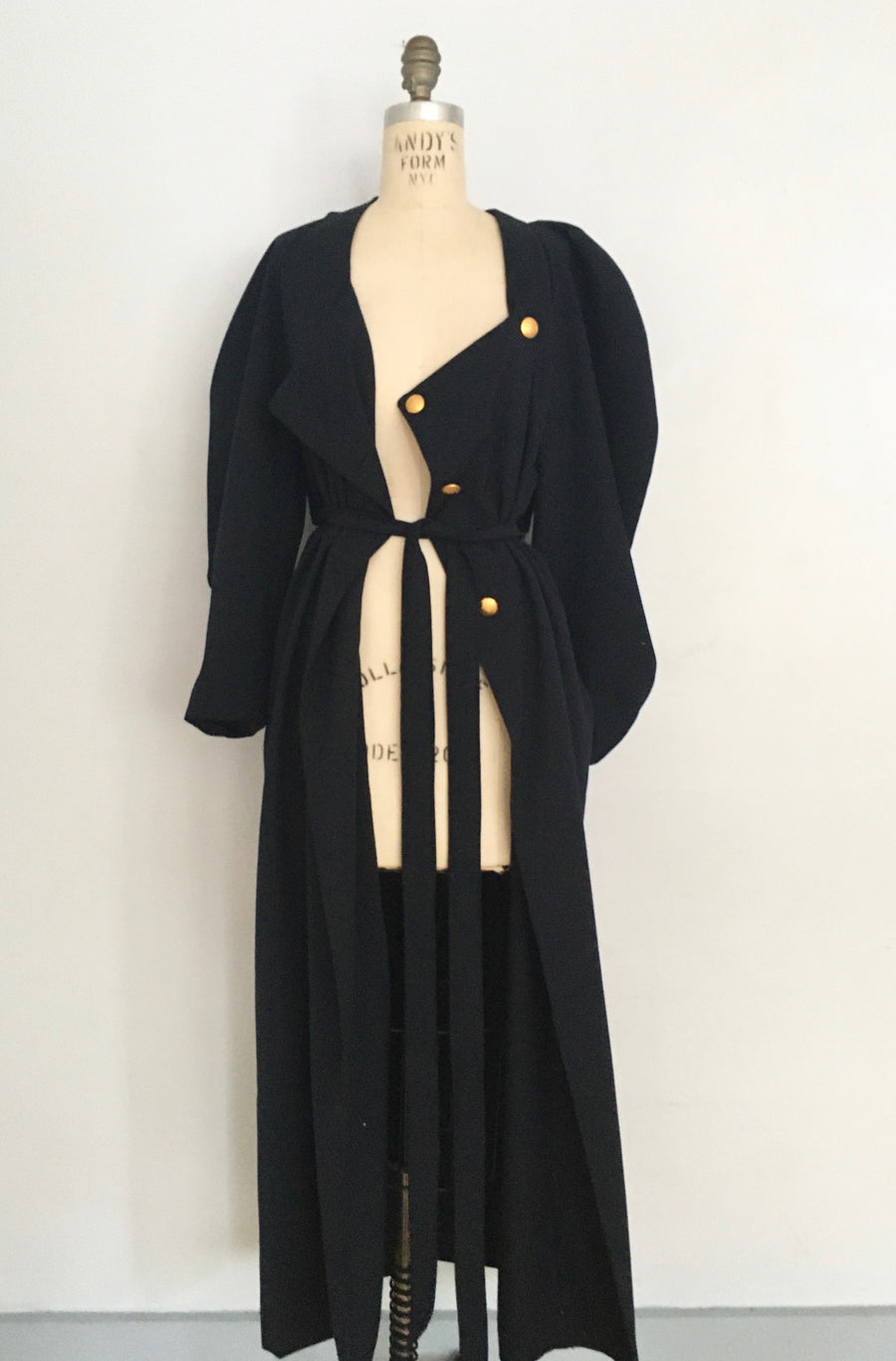 long dress w/ big curved sleeves and gold buttons