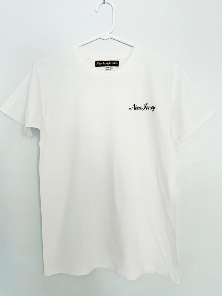 Handmade New Jersey screen-printed t-shirt by Sarah Aphrodite, made from salvaged white cotton. Features unique markings and shadings from upcycled fabric, soft and comfortable.