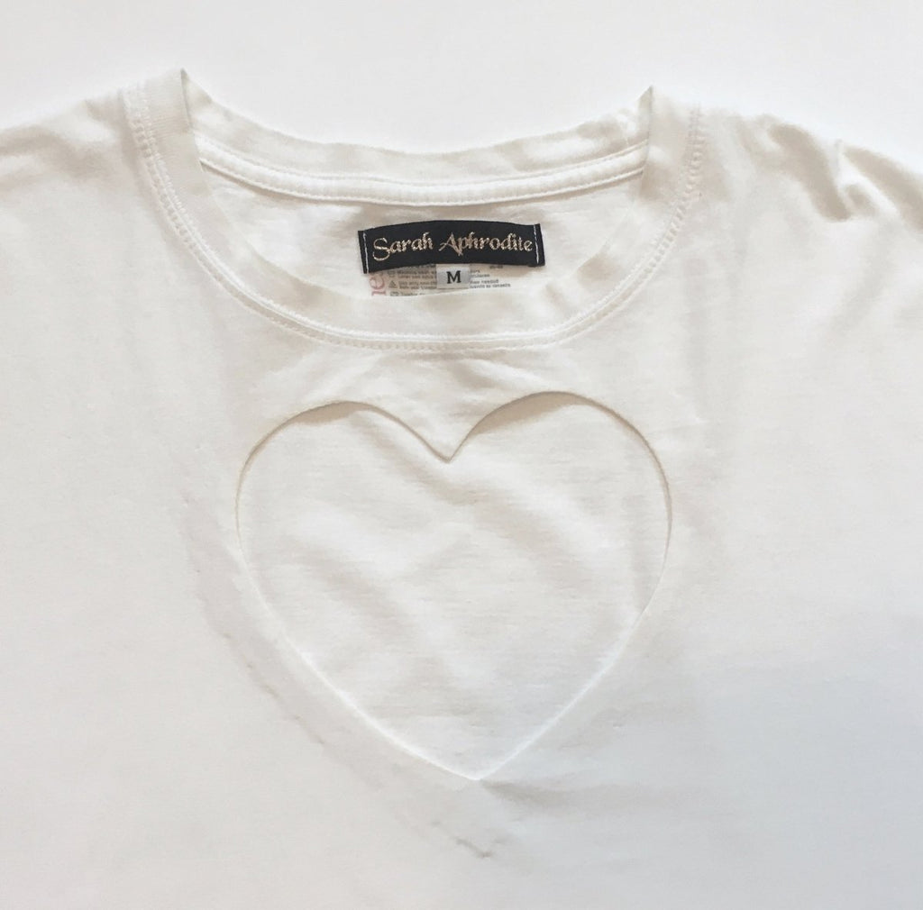 One-of-a-kind oversized t-shirt by Sarah Aphrodite, handmade from upcycled black or white cotton t-shirt. Features two hand-cut hearts, and unique markings for a casual, sexy, sustainable style.