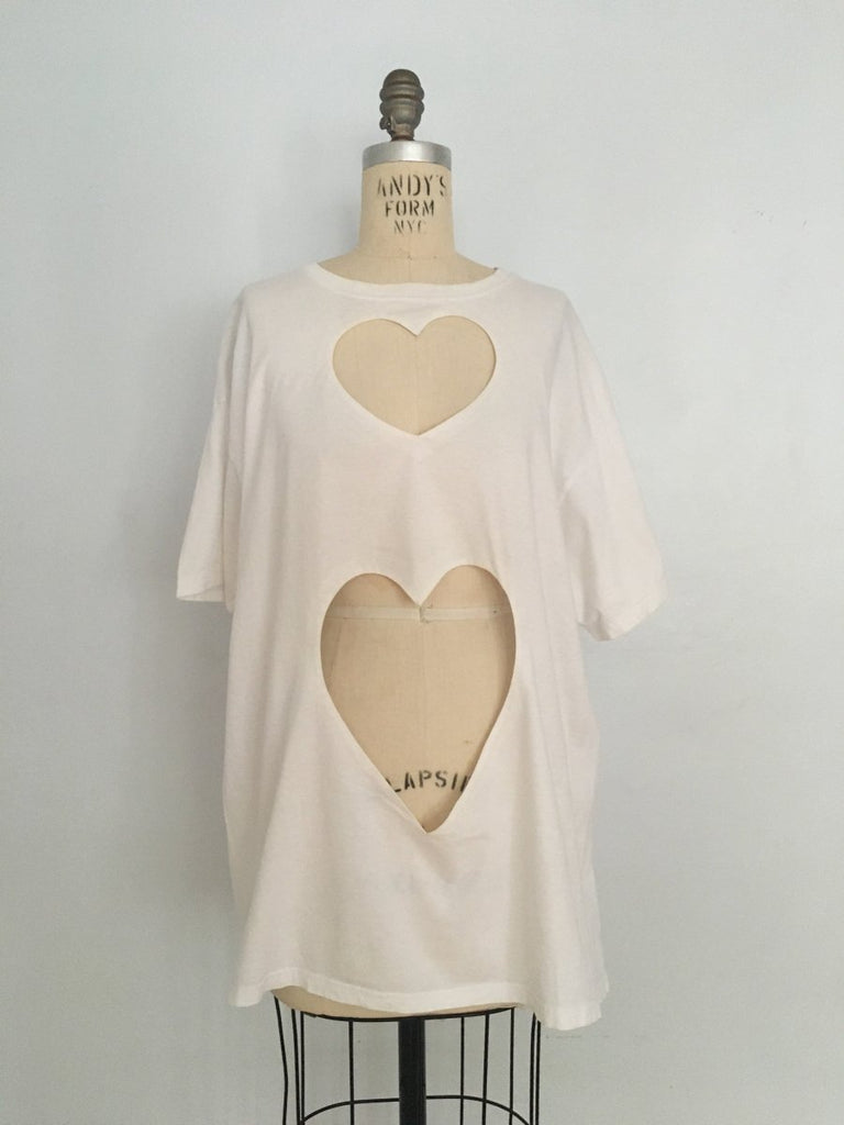 One-of-a-kind oversized t-shirt by Sarah Aphrodite, handmade from upcycled black or white cotton t-shirt. Features two hand-cut hearts, and unique markings for a casual, sexy, sustainable style.