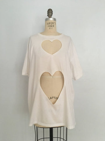 One-of-a-kind oversized t-shirt by Sarah Aphrodite, handmade from upcycled black or white cotton t-shirt. Features two hand-cut hearts, and unique markings for a casual, sexy, sustainable style.