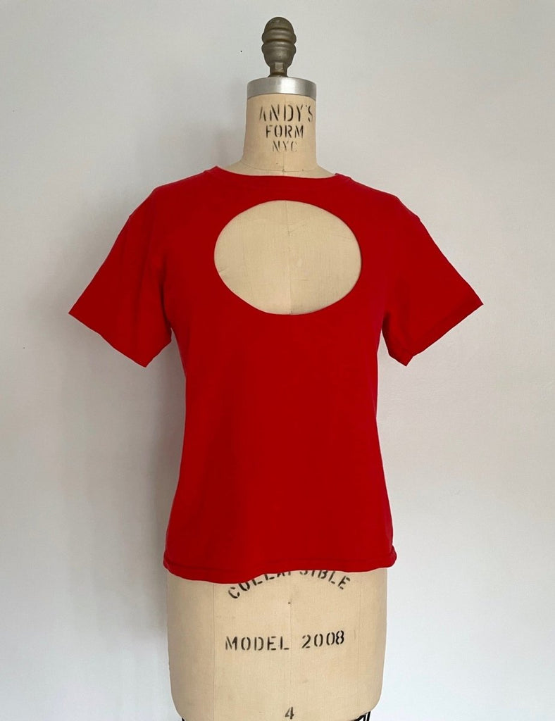 One-of-a-kind red vintage t-shirt with hand-sewn oval cut-out by Sarah Aphrodite. Handmade, sustainable, fits XS/S, and designed for bold creative styling.
