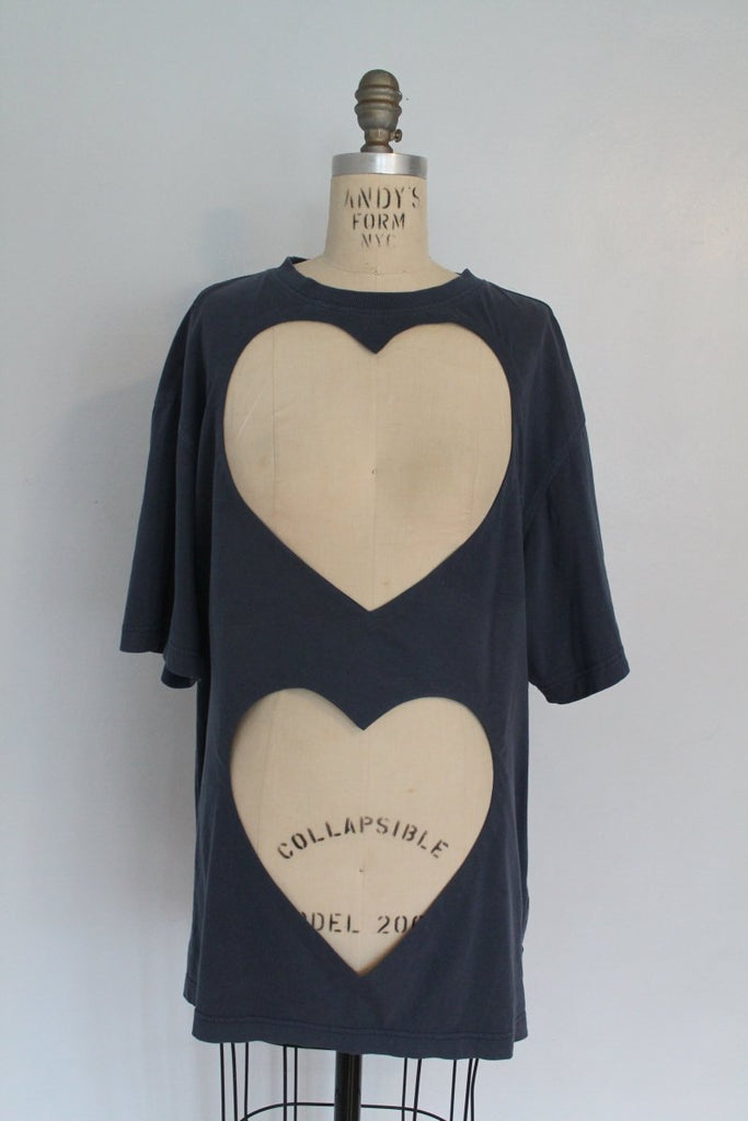 One-of-a-kind repurposed denim-blue heart cut-out tee by Sarah Aphrodite, hand-sewn from vintage t-shirts. Large heart openings for layering, soft washed fabric, one size fits all.