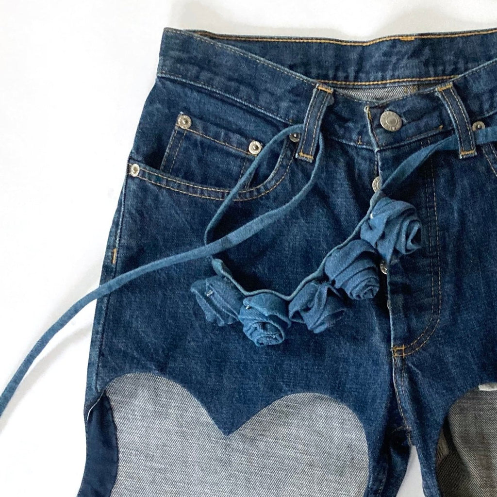 Handmade one-of-a-kind denim rose belt and bow accessories by Sarah Aphrodite. Crafted from repurposed denim scraps, sustainable and unique, versatile to wear around waist, shoulder, leg, arm, or ankle.