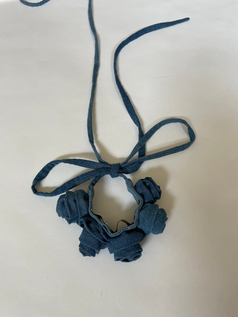 Handmade one-of-a-kind denim rose belt by Sarah Aphrodite. Crafted from repurposed denim scraps, sustainable and unique, versatile to wear around waist, shoulder, leg, arm, or ankle.