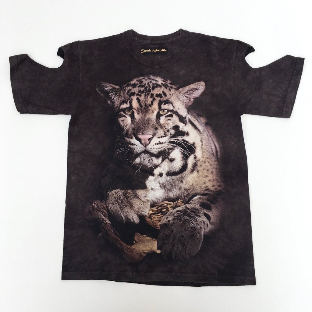One-of-a-kind vintage Jaguar print tee by Sarah Aphrodite, handmade from 100% repurposed cotton. Features heart cut-outs on the arms, XS–S fit, and unique markings from upcycled fabric.
