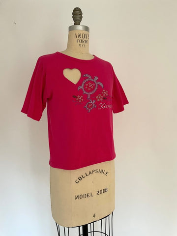 One-of-a-kind heart cut-out t-shirt with rhinestone “Kauai” print, handmade from a salvaged cotton shirt, displayed on an XS mannequin