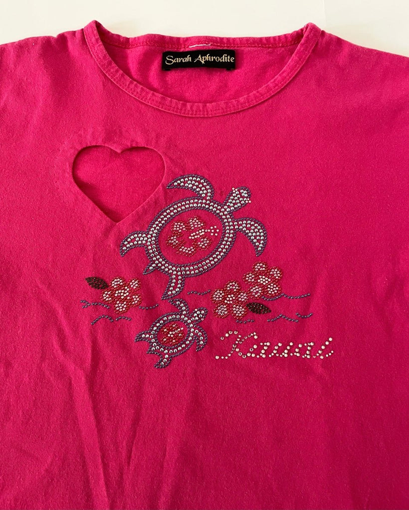 heart cut out detail of a one-of-a-kind heart cut-out t-shirt with rhinestone “Kauai” print, handmade from a salvaged cotton shirt